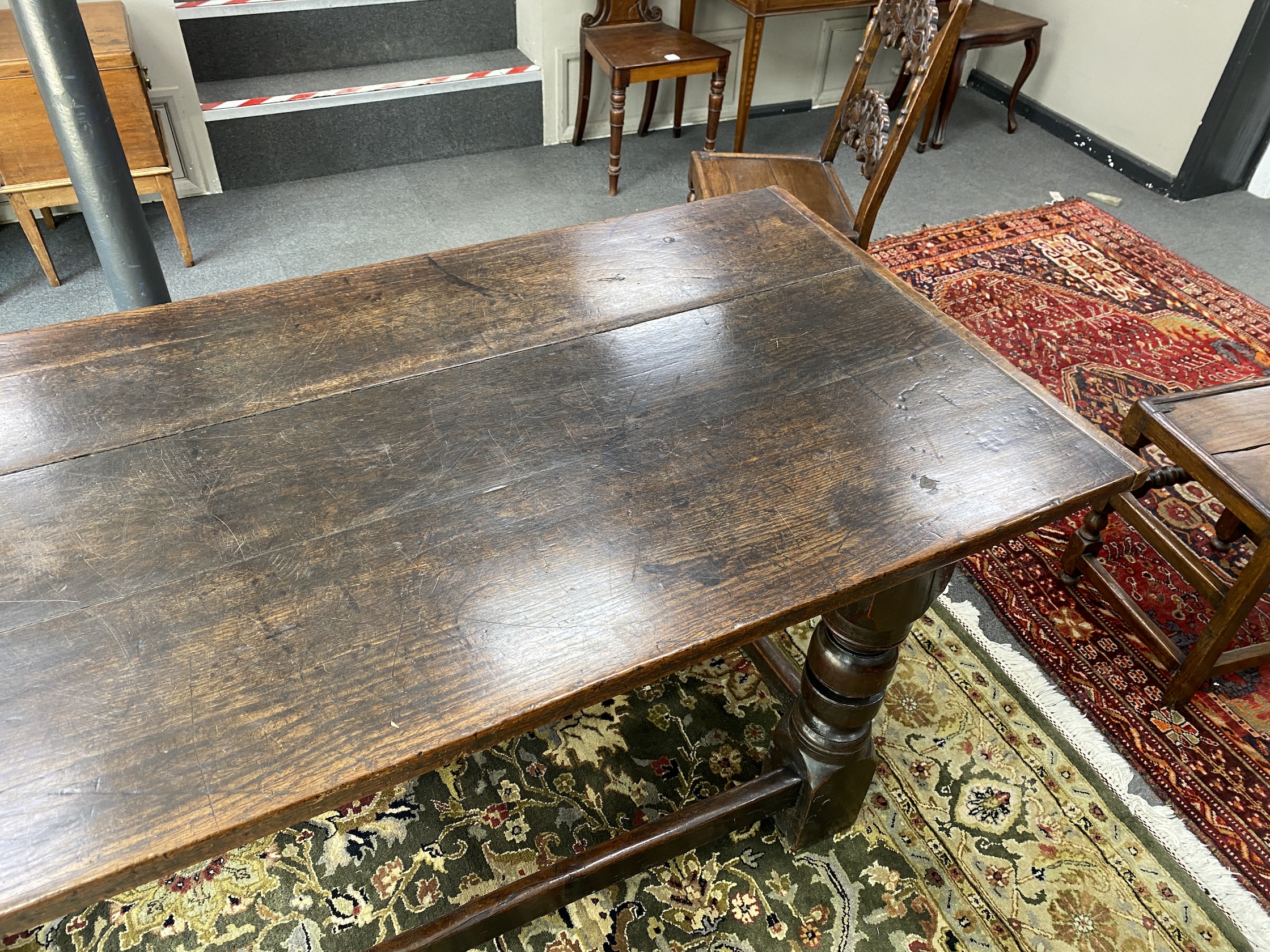 An 18th century and later rectangular oak refectory dining table, length 194cm, width 83cm, height 79cm and two Derbyshire style oak chairs